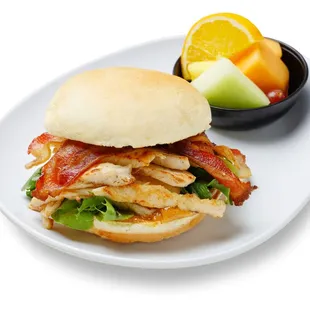 a chicken sandwich with bacon and lettuce