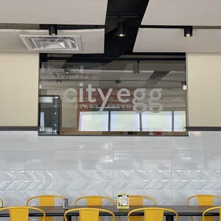a restaurant with yellow chairs