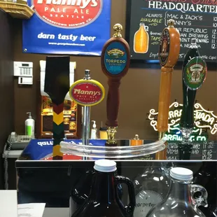 a variety of beers on a counter