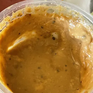 What appears to be curdled beer cheese served with pretzels. (My husband ate most of it.  I tried one bite. No thank you)