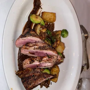 a plate of meat and vegetables