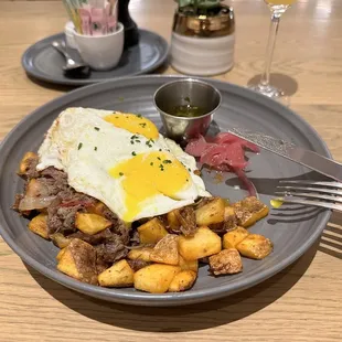So good! SHORT-RIB AND POTATO HASH -  two sunny side eggs, caramelized onions,peppers,chimichurri