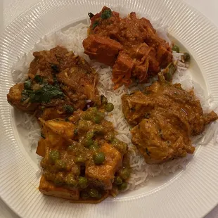 We had takeout and here is butter chicken, garlic chicken, and matar paneer, plated at home