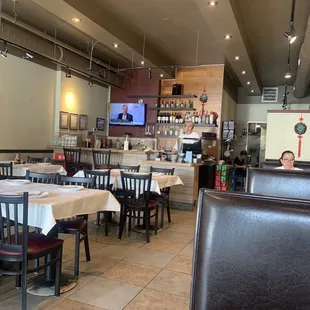 a restaurant with tables and chairs