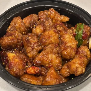 General Tso's Chicken. Not the worst I've had but lacking heat &amp; chicken is dry and stringy. Somewhat sweet...