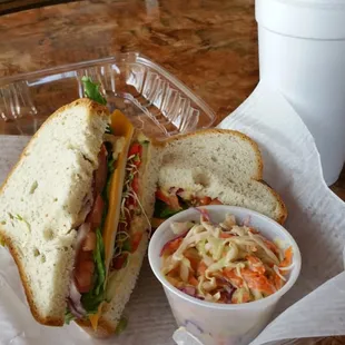 Veggie sandwich on gluten-free bread, cole slaw, and soda: