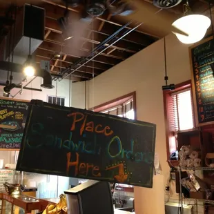 a sign that reads please sandwich only here