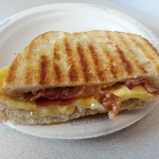 Half of a bacon and ghouda breakfast panini - yummmm