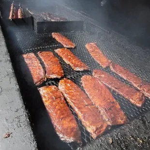 meat being cooked on a grill