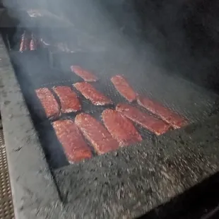 meat being cooked on a grill