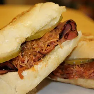 two pulled pork sandwiches on a plate