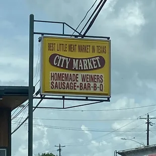 a sign for the best little meat market in texas