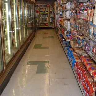 a grocery store aisle with a variety of products