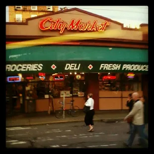 people walking in front of the store