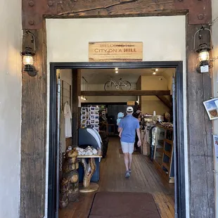 a woman walking through the doorway