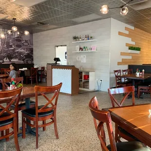a restaurant with tables and chairs
