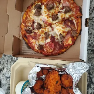 mini carnivore and their chicken wings to go