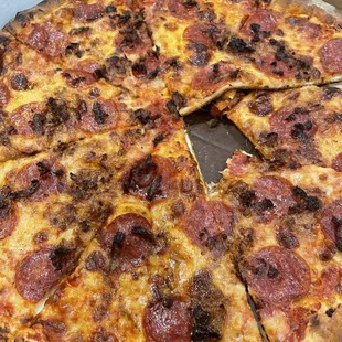 This is the picture of my burnt pepperoni and sausage pizza