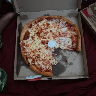Pizza delivered messy, as if it was tossed around in the car while being delivered..
