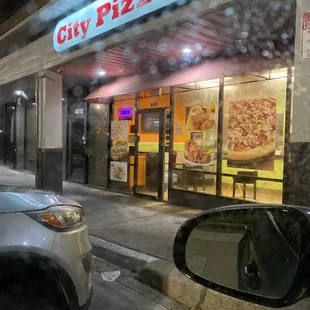 a car parked in front of a restaurant