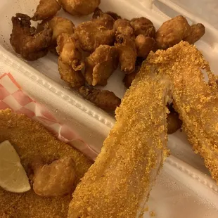 Popcorn shrimp fried about 10 times and over cooked fish. They literally delivered their food that was ready for the trash.