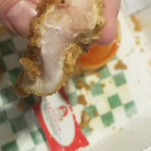 Ordered a 6pc chicken strip meal.... found RAW chicken. When trying to obtain my refund, Shahid (spelling?) The manager wanted proof. Here.