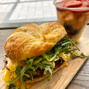 a croissant sandwich on a cutting board