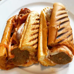 a grilled meatball sandwich on a plate