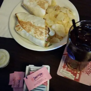 a plate of food and drink on a table