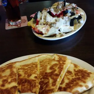 a plate of quesadillas and a salad