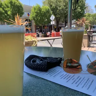 a drink and sunglasses on a table