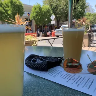 a drink and sunglasses on a table