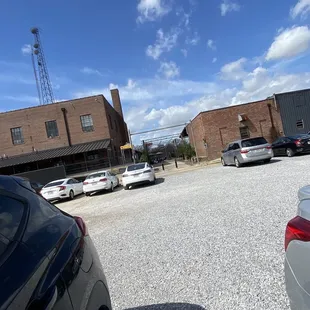 Outside! Go between those two buildings and you'll se it on the left hand side!