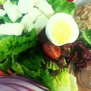 Nutty salad with honey vinaigrette Sift mozzarella,  almond,  walnut and more healthy stuff on fresh romaine