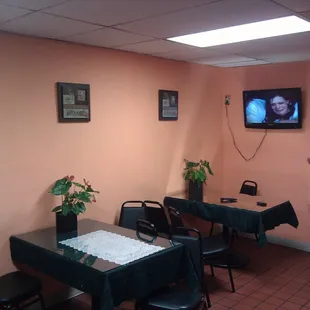 a dining room with a flat screen tv
