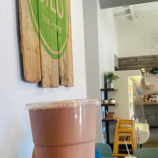 a hand holding a cup of coffee