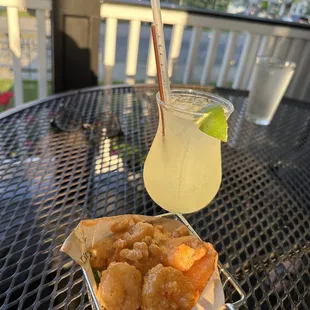 a glass of lemonade and a plate of food