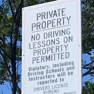 Sign said: No driving lessons in the parking lot.