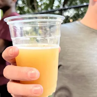 a man holding a glass of beer