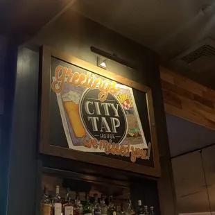 a sign above the bar