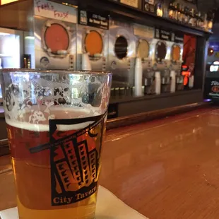 a pint of beer on the bar