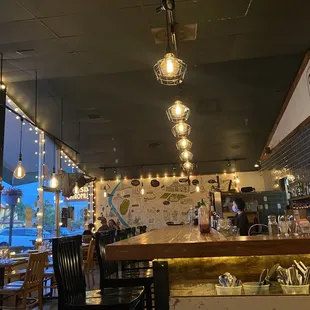 a view of the bar and dining area