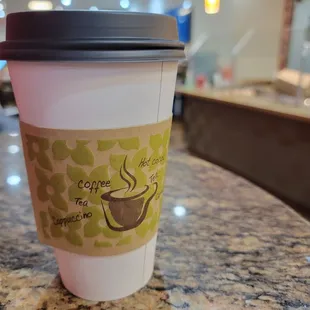 a cup of coffee on a table