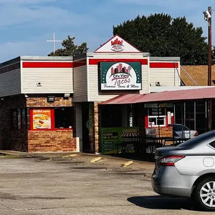 a car parked in front of a restaurant