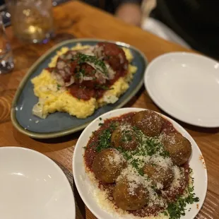 three plates of meatballs and grits