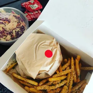 Spicy chicken sandwich, fries, coleslaw