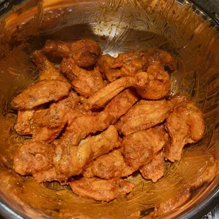 a bowl of chicken wings