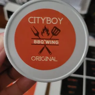 a person holding a container