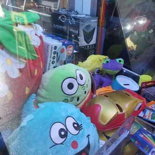 a variety of toys in a store window
