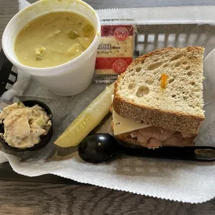 a sandwich, soup and pickle